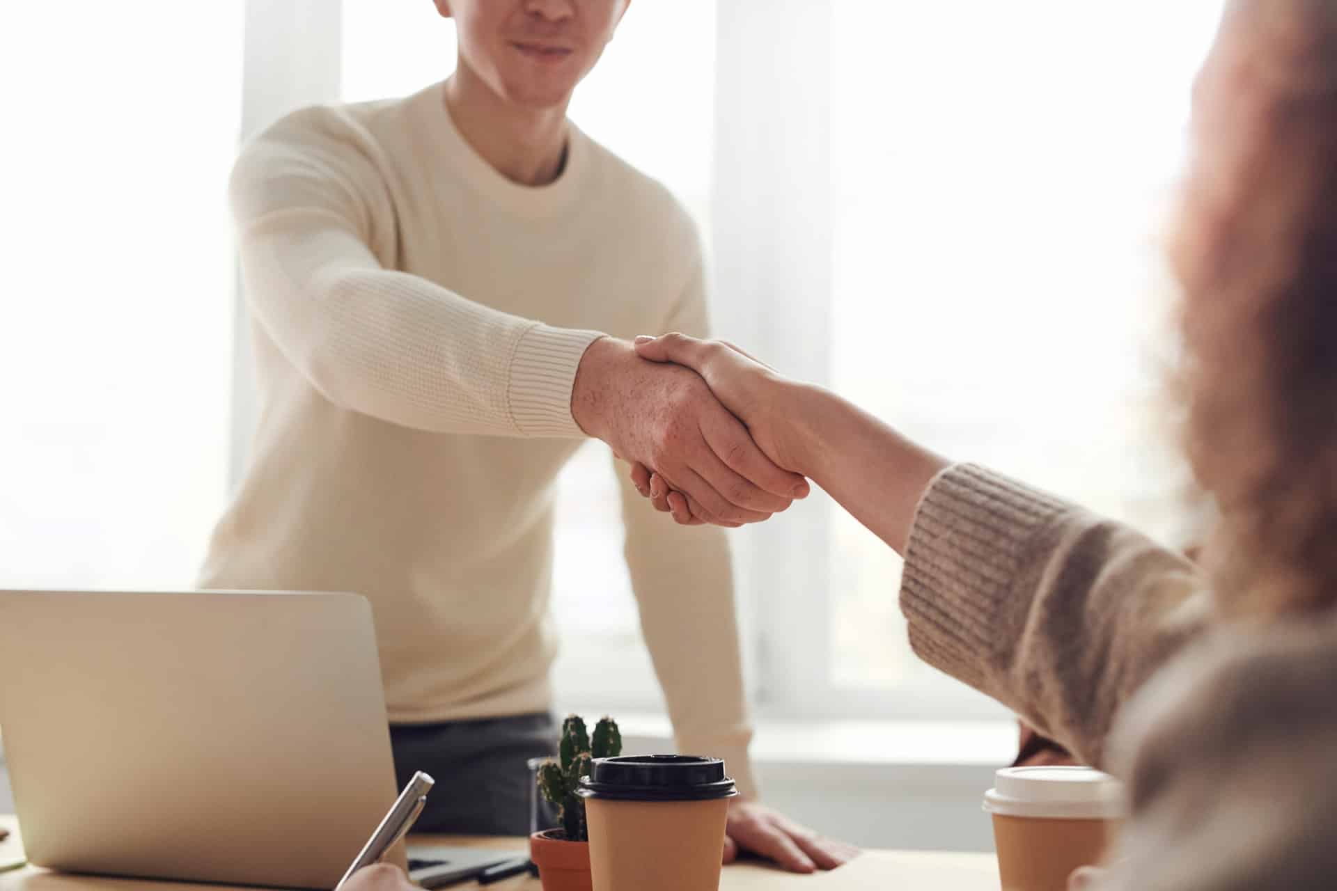 Image of 2 people shaking hands