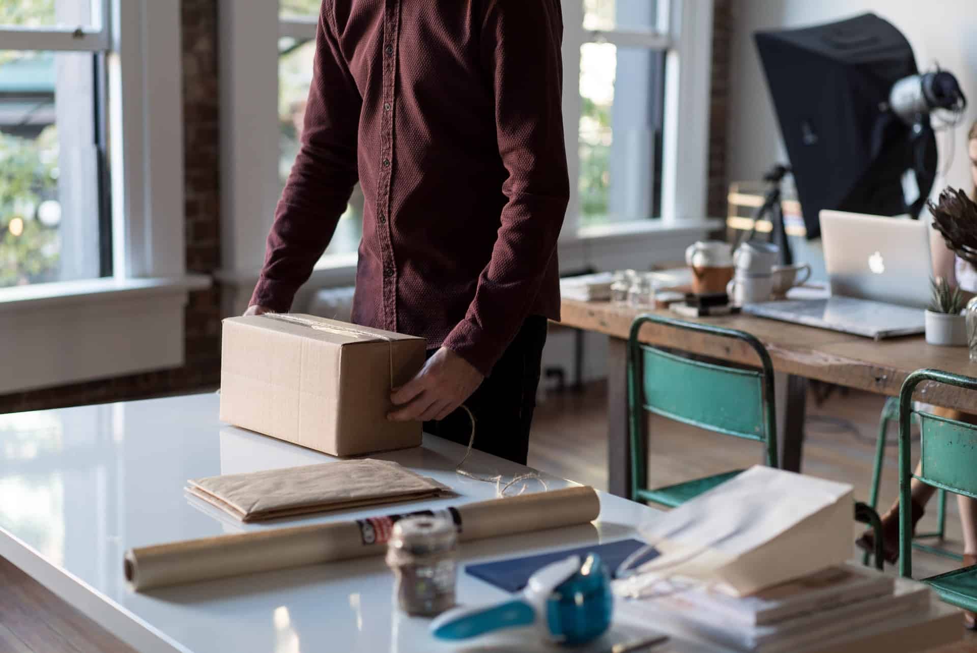 Man prepping shipping box