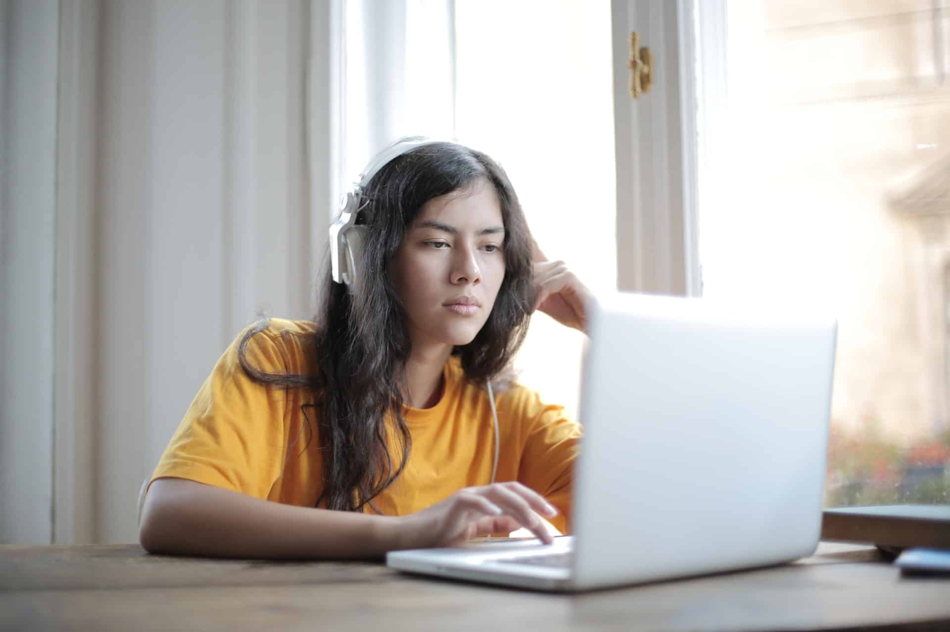 Woman with headphones reading