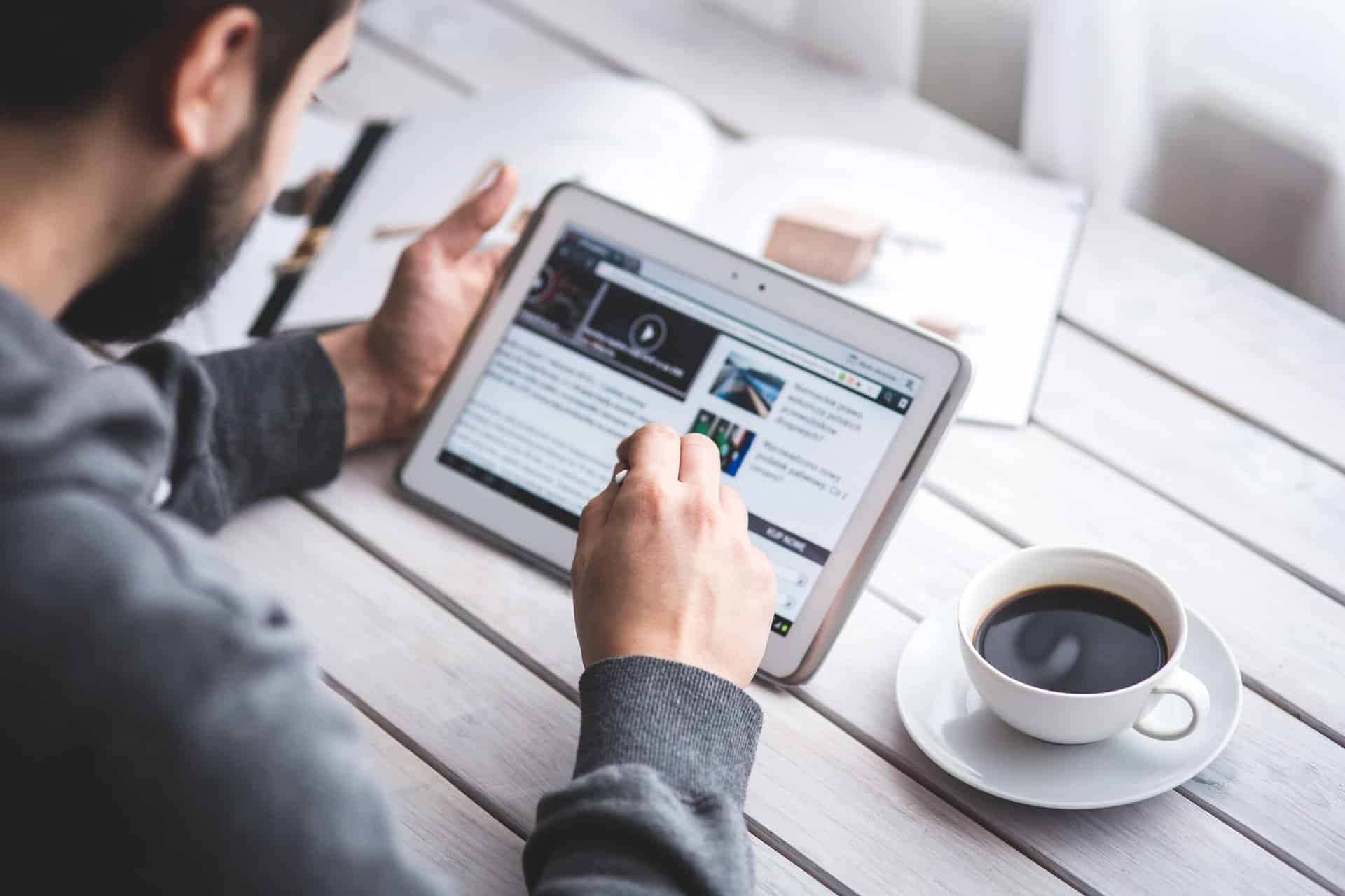 Man reading using laptop