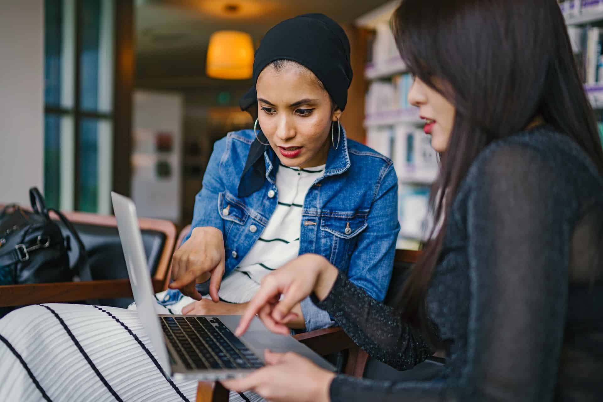 Woman pointing at laptop