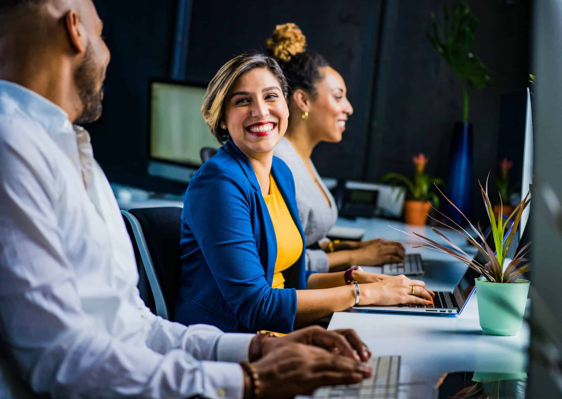 Woman smiling at coworker 