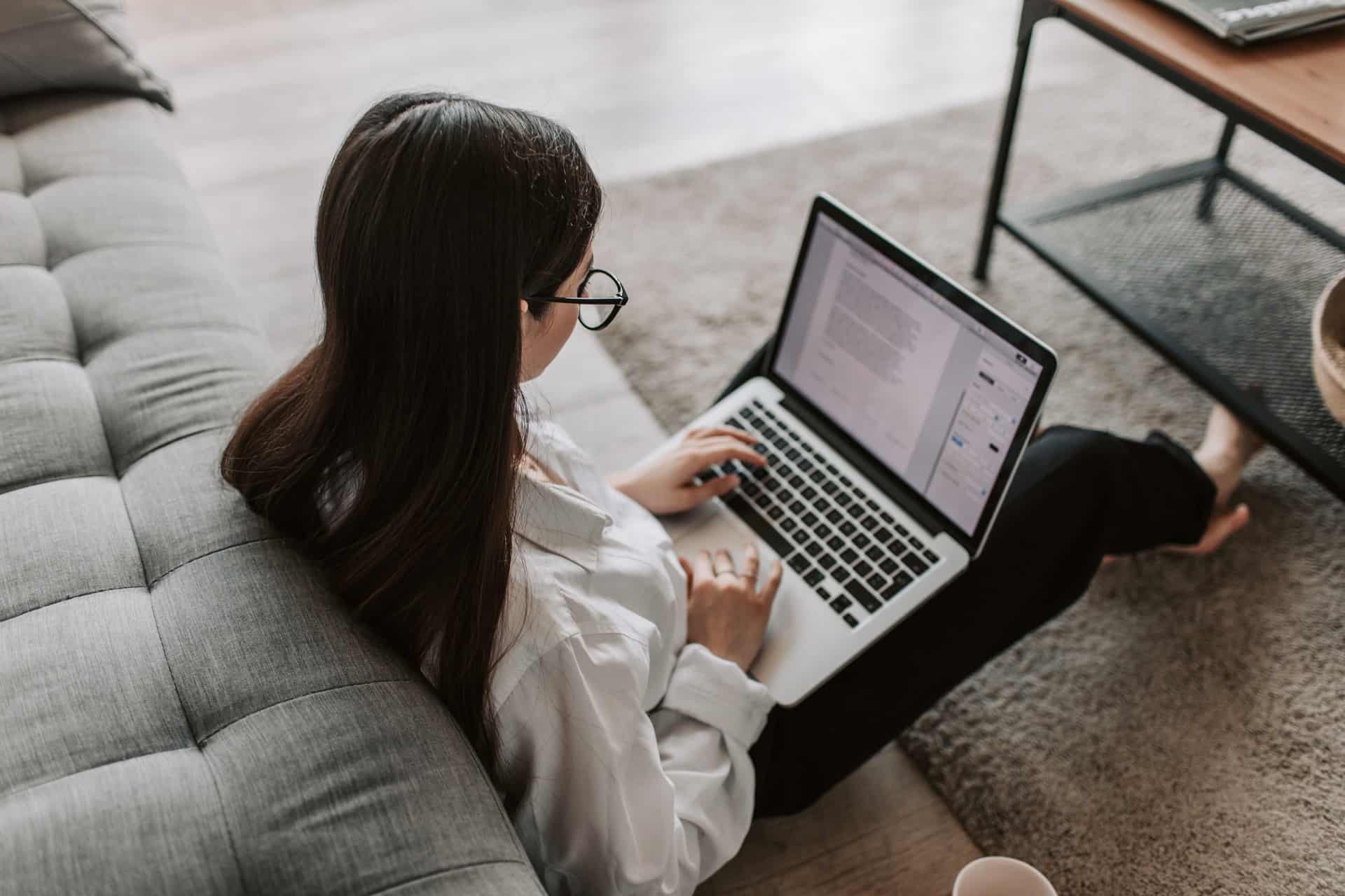 Woman typing on laptop