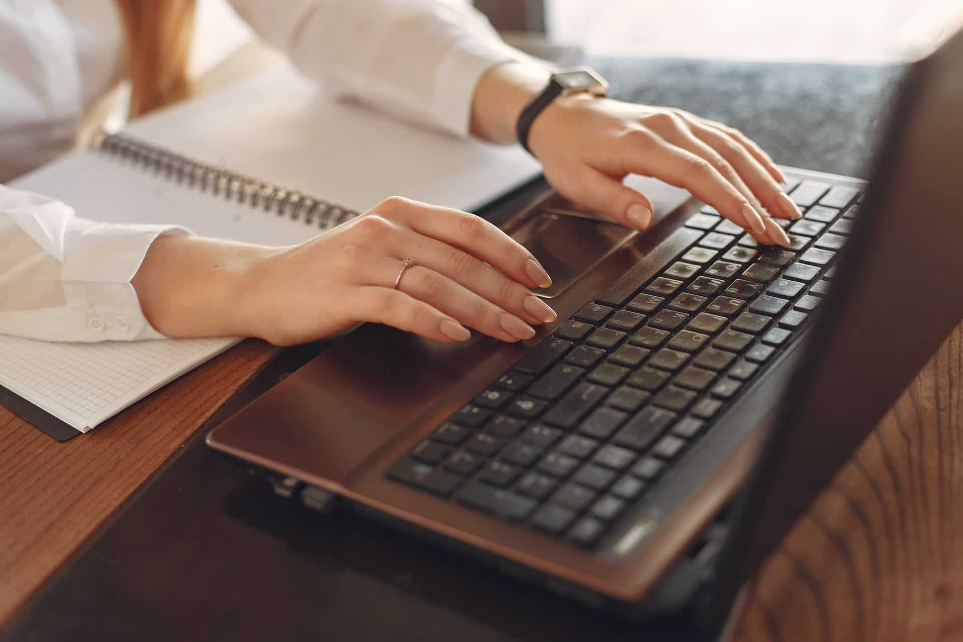 Girl typing on laptop