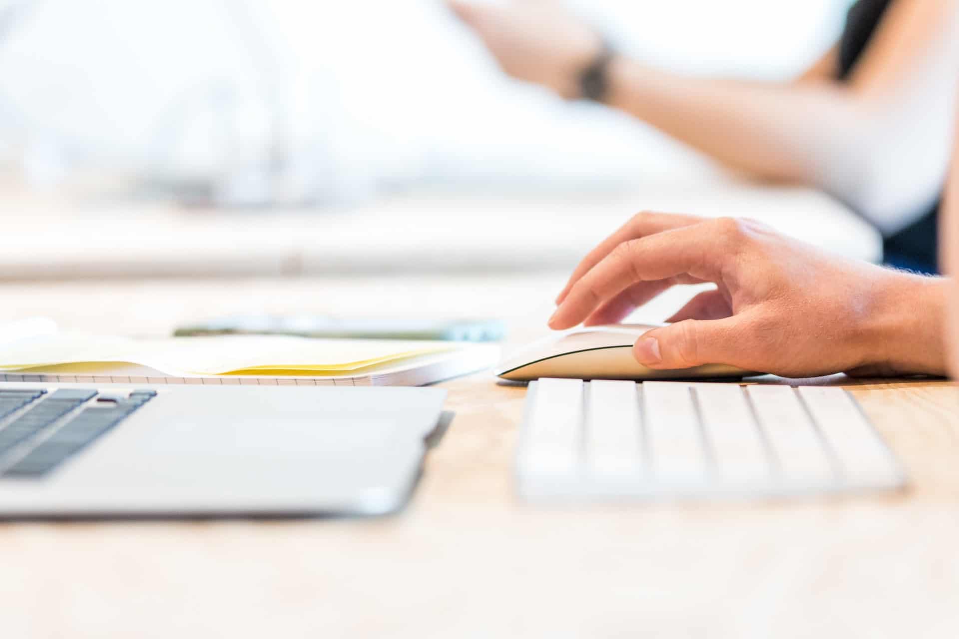 Person clicking computer mouse