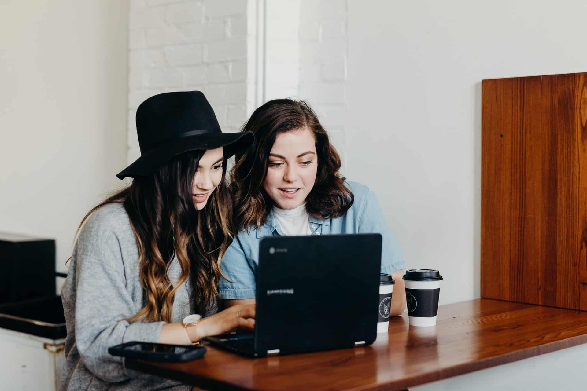 Two girls looking at laptop