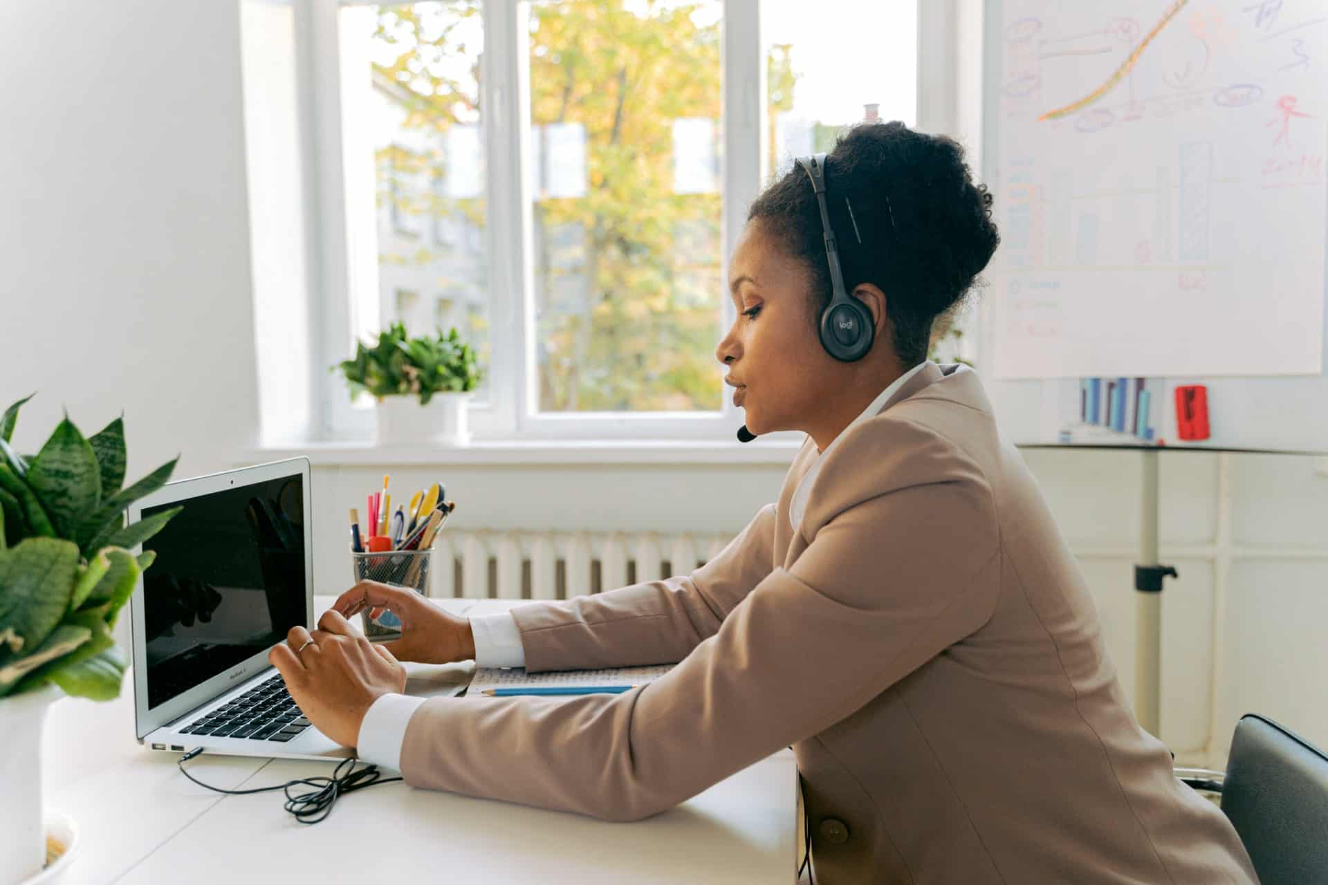 Female customer service agent using laptop