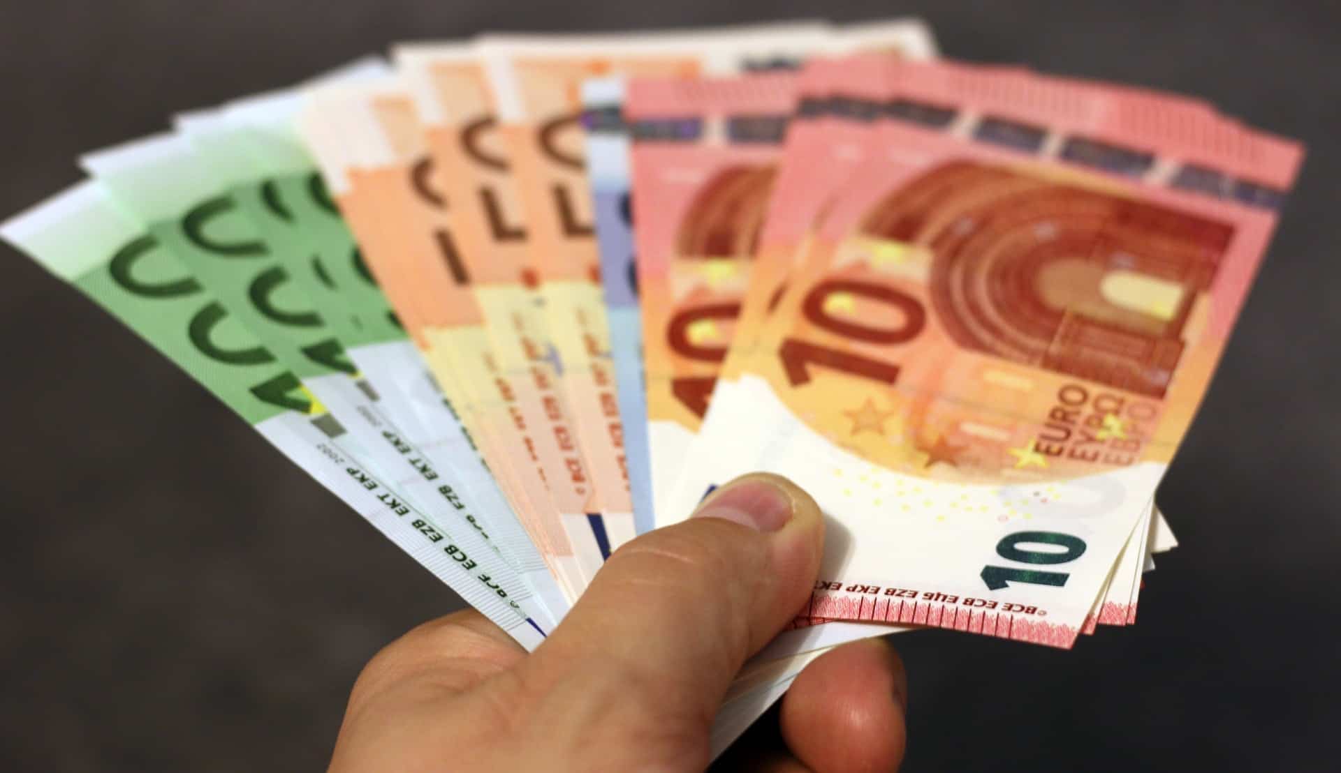 Person holding euros