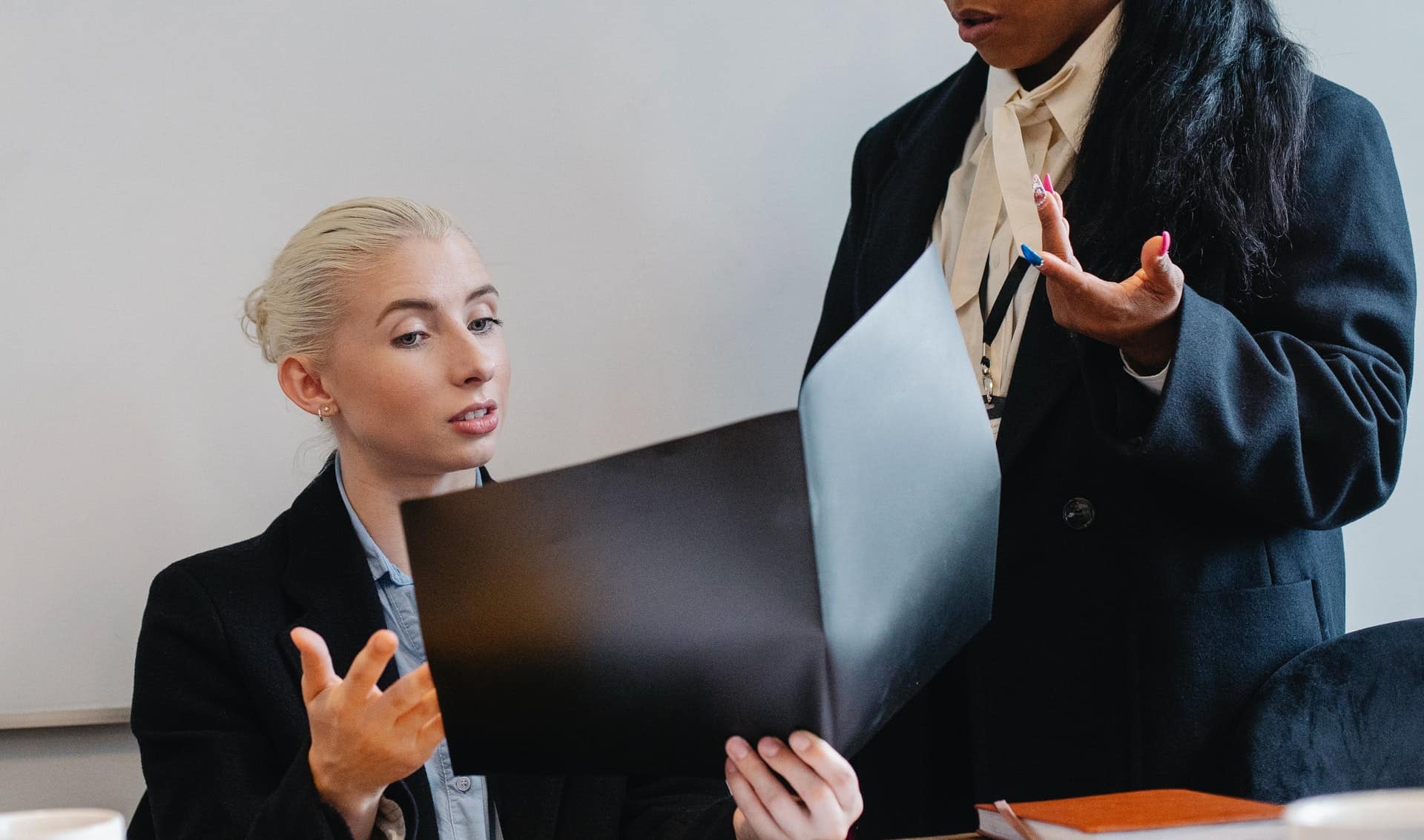 Woman looking at open folder