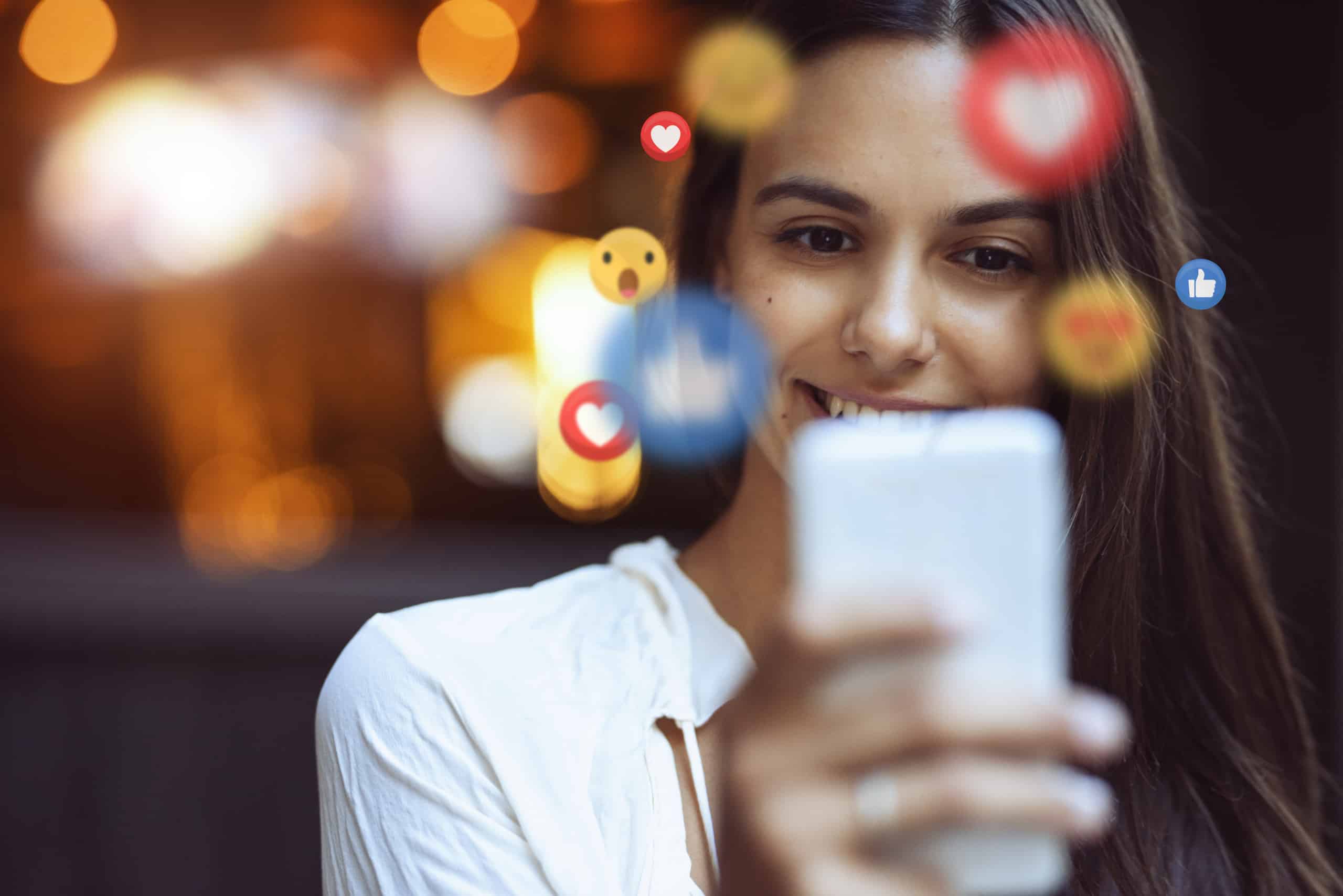 Woman smiling at phone