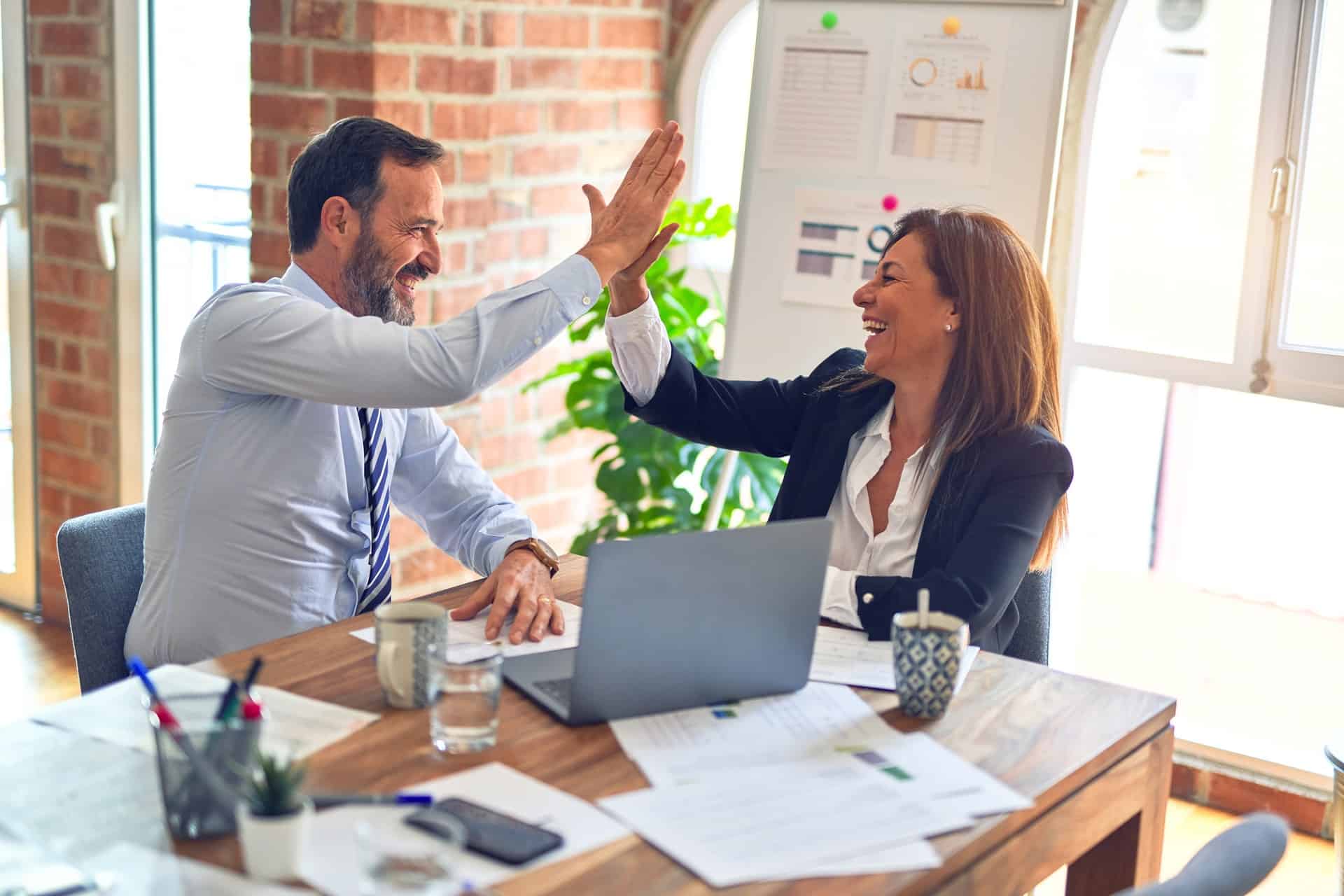 Coworkers high fiving