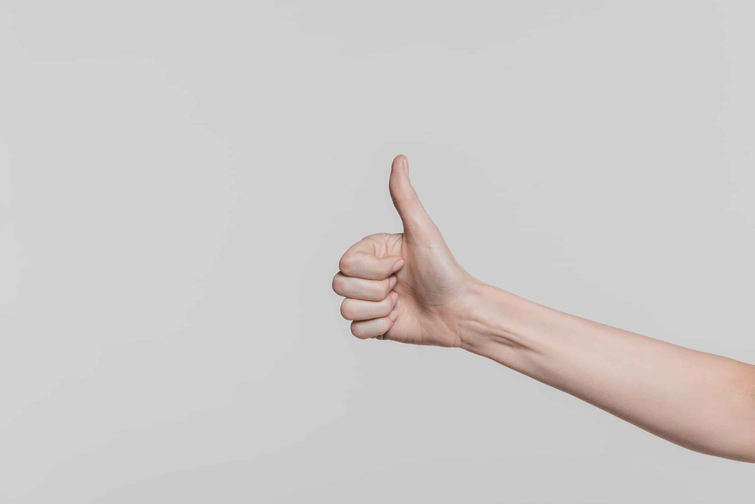 Person showing thumbs up