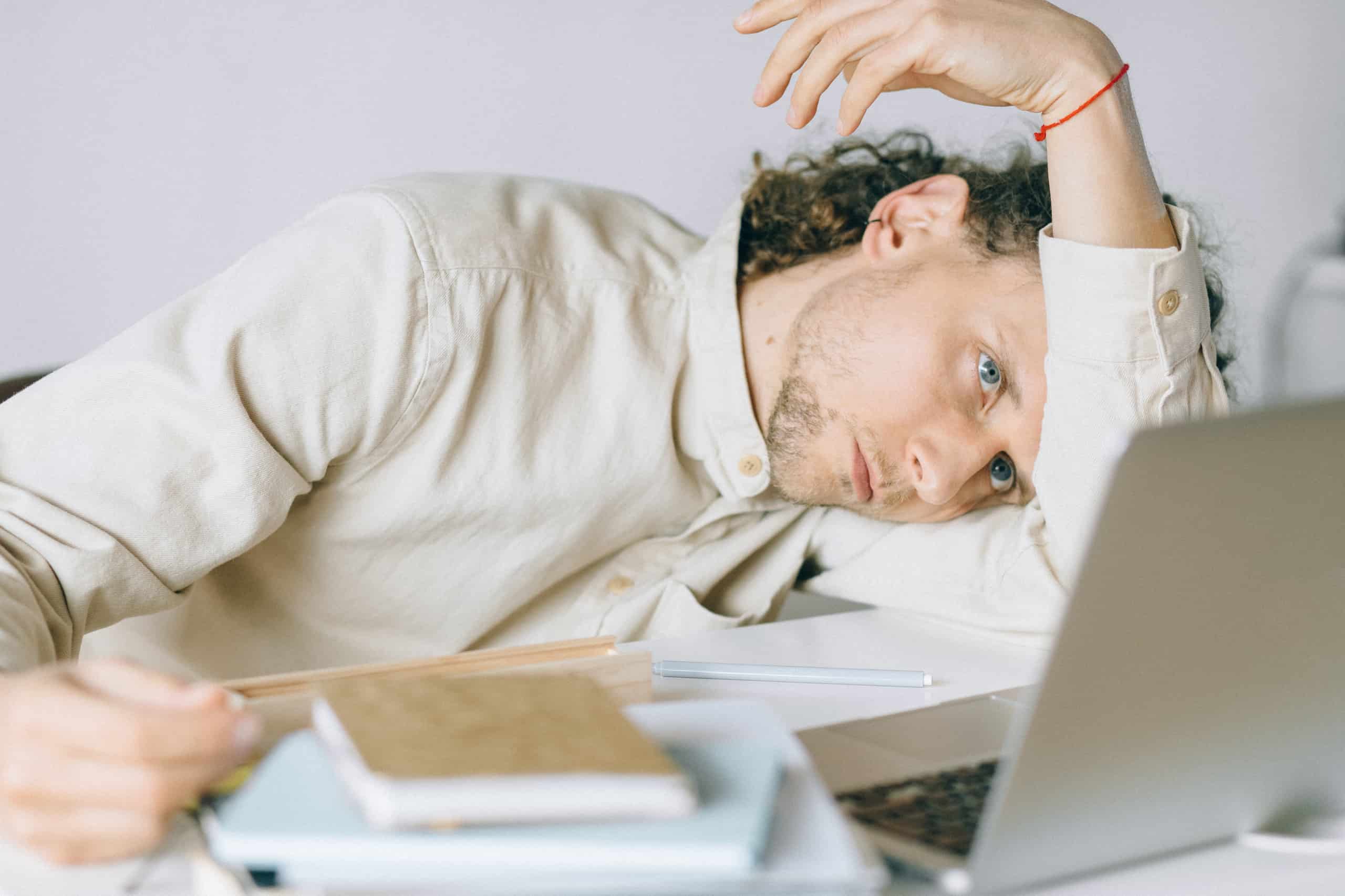 Man looking at laptop stressed