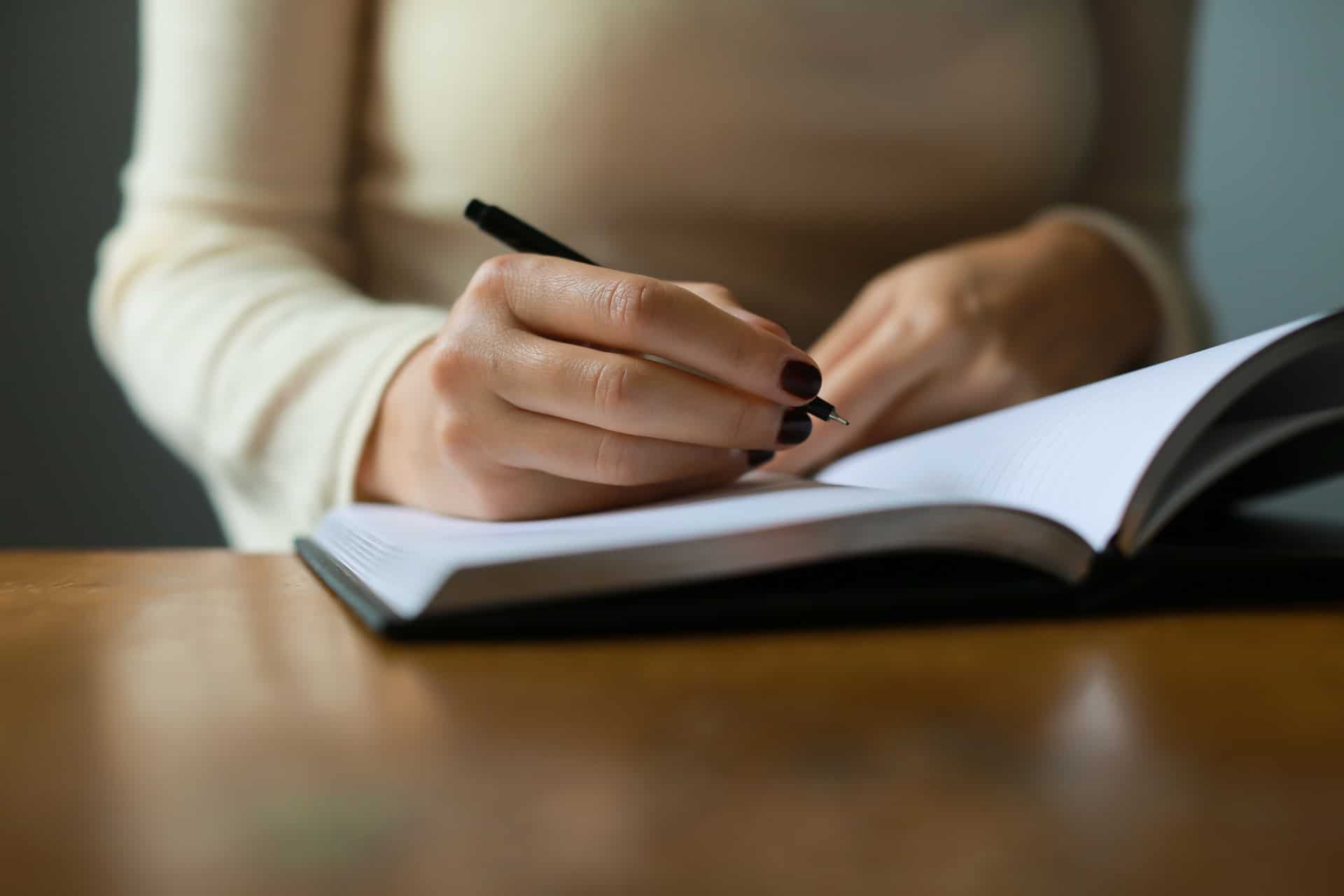 Woman writing in notebook