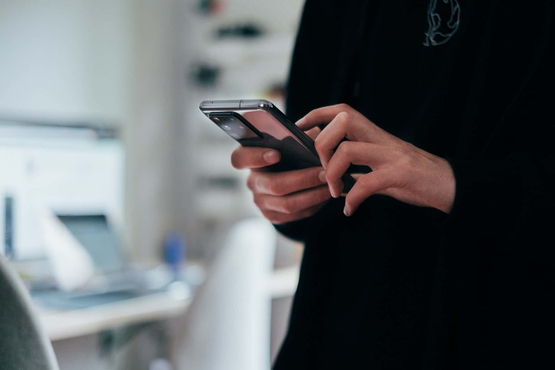 Person touching smartphone