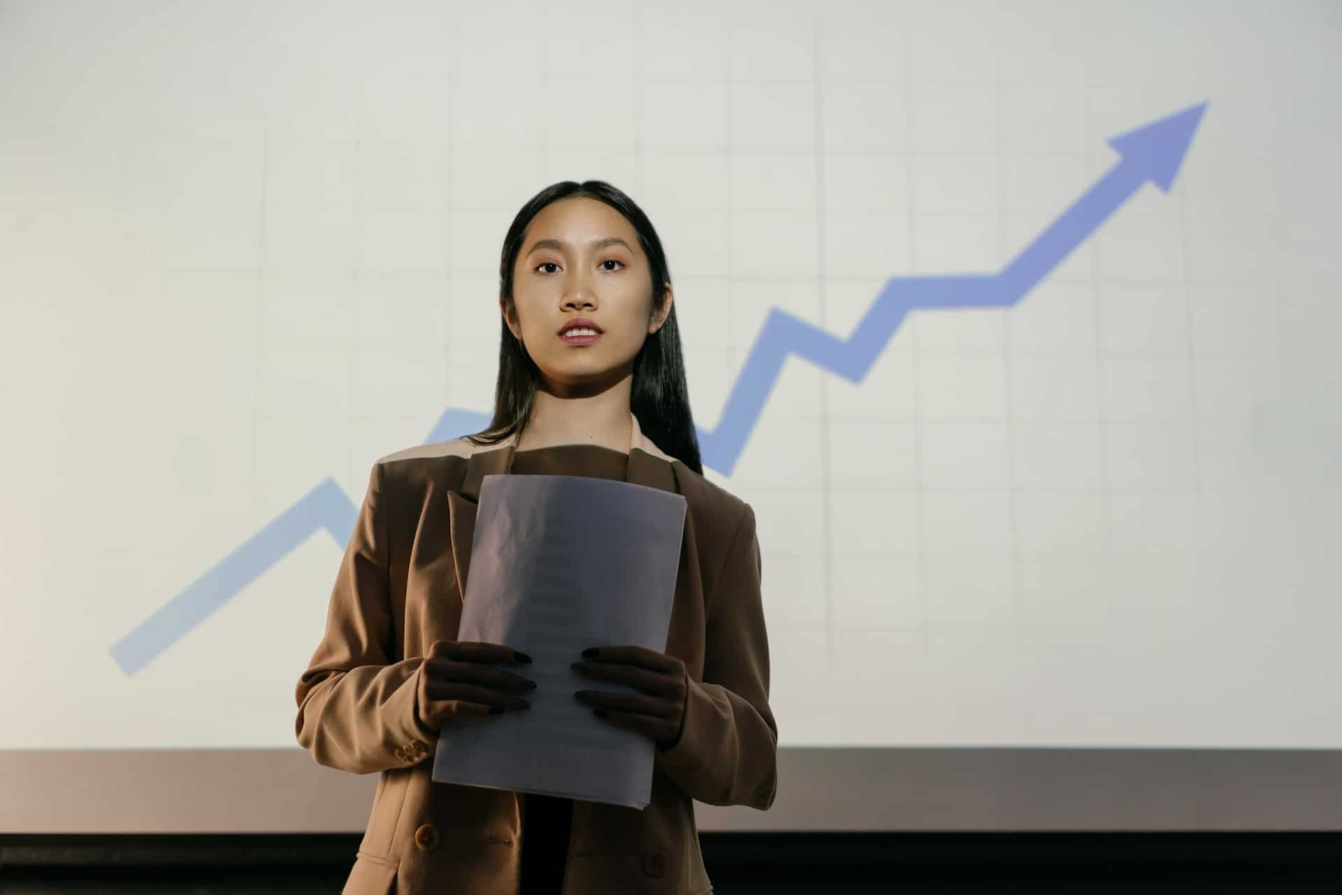 Woman standing in front of chart