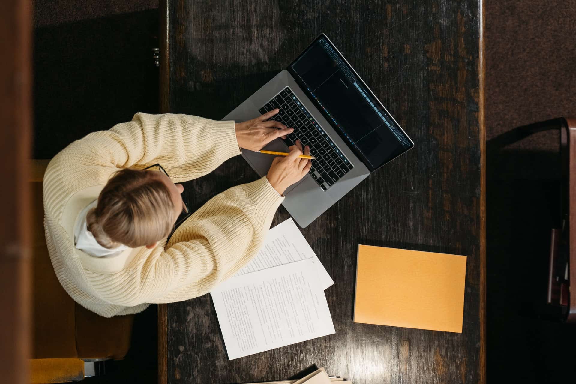 Woman using laptop in library