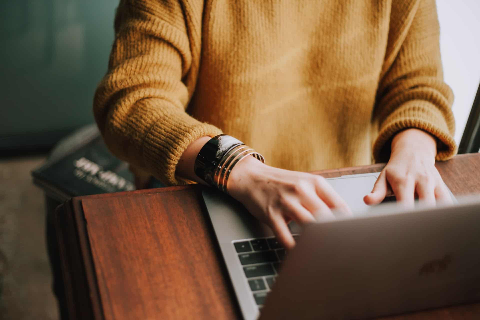 Girl typing on laptop