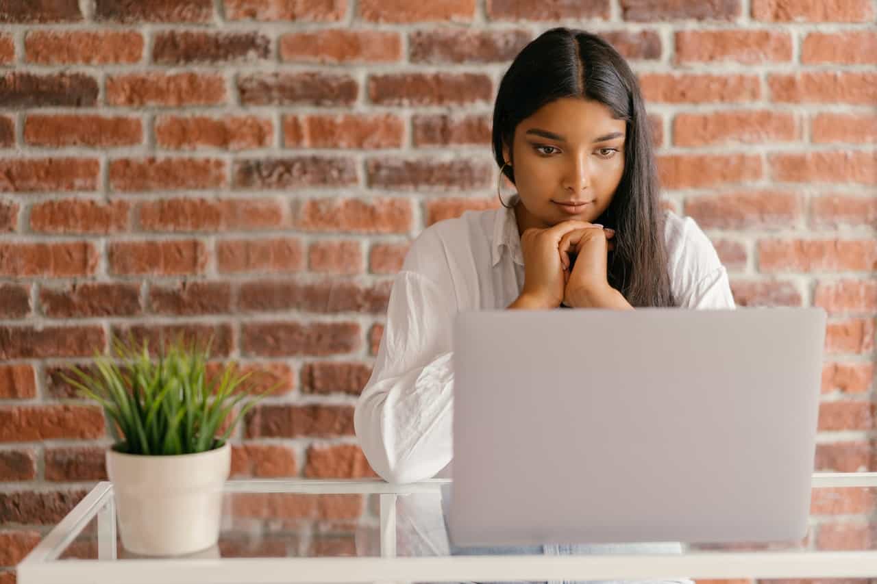 Girl reading from laptop