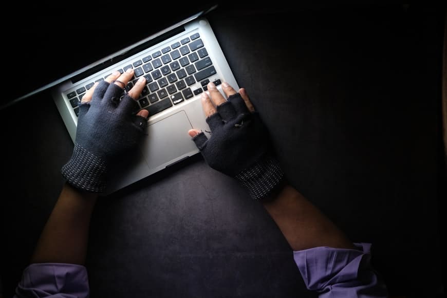 Hacker hands stealing data
