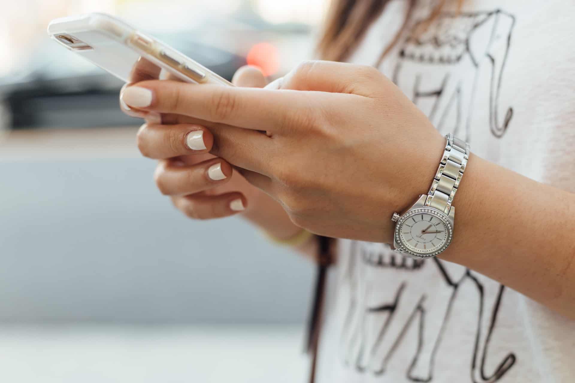 Girl typing on mobile phone