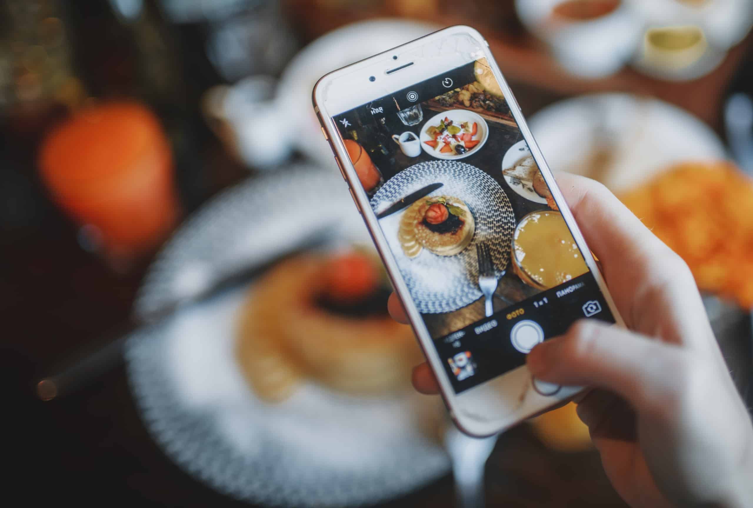 Person taking photo of food