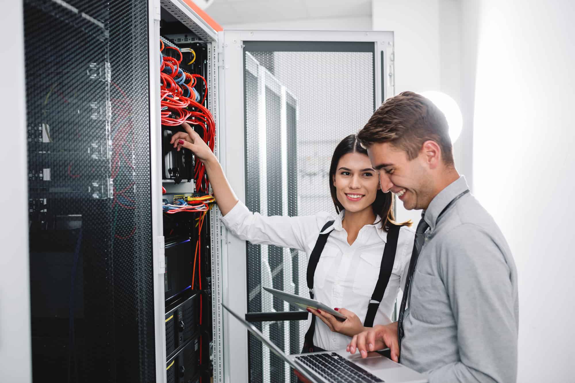 Two young people in server room