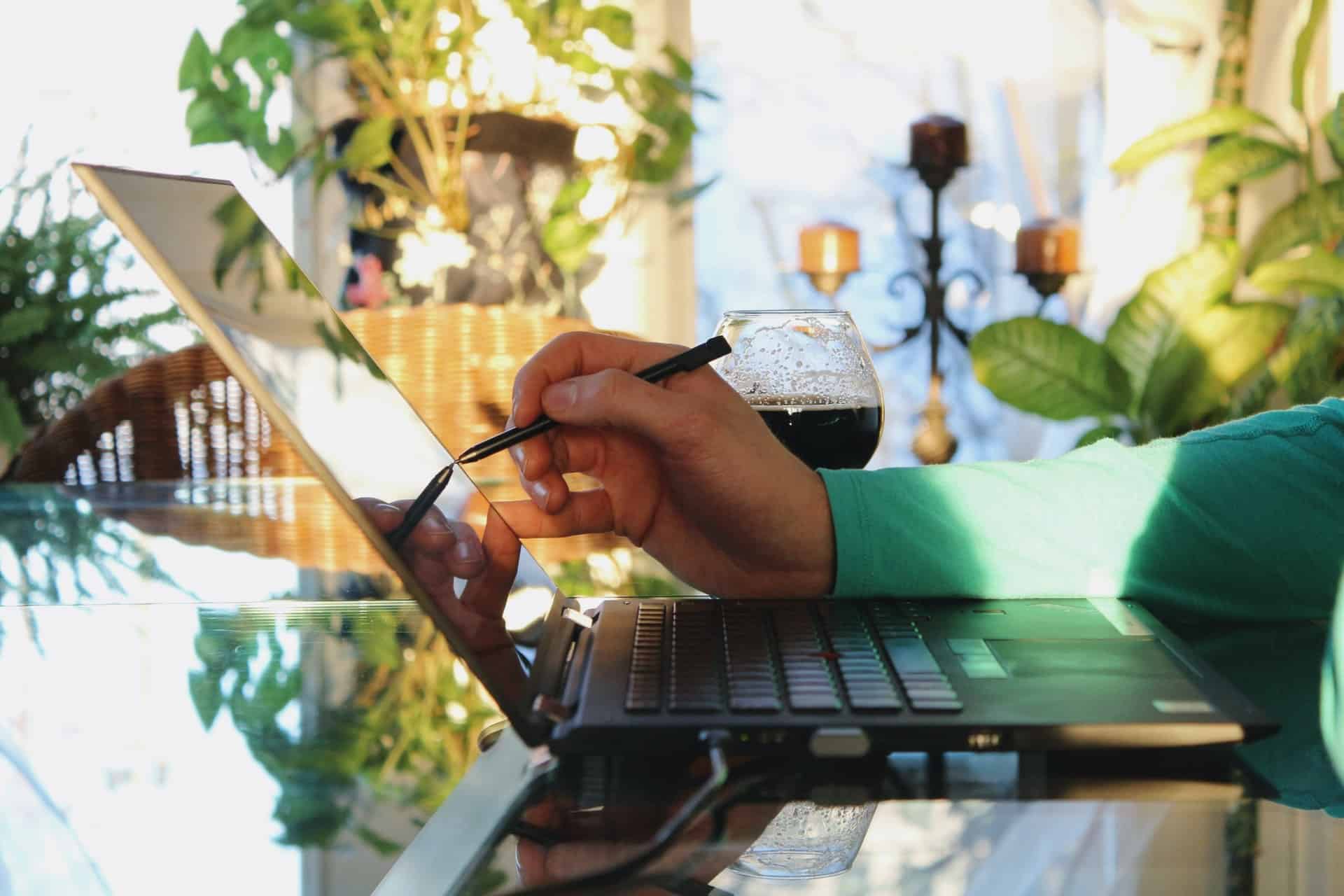 Person using touchscreen laptop