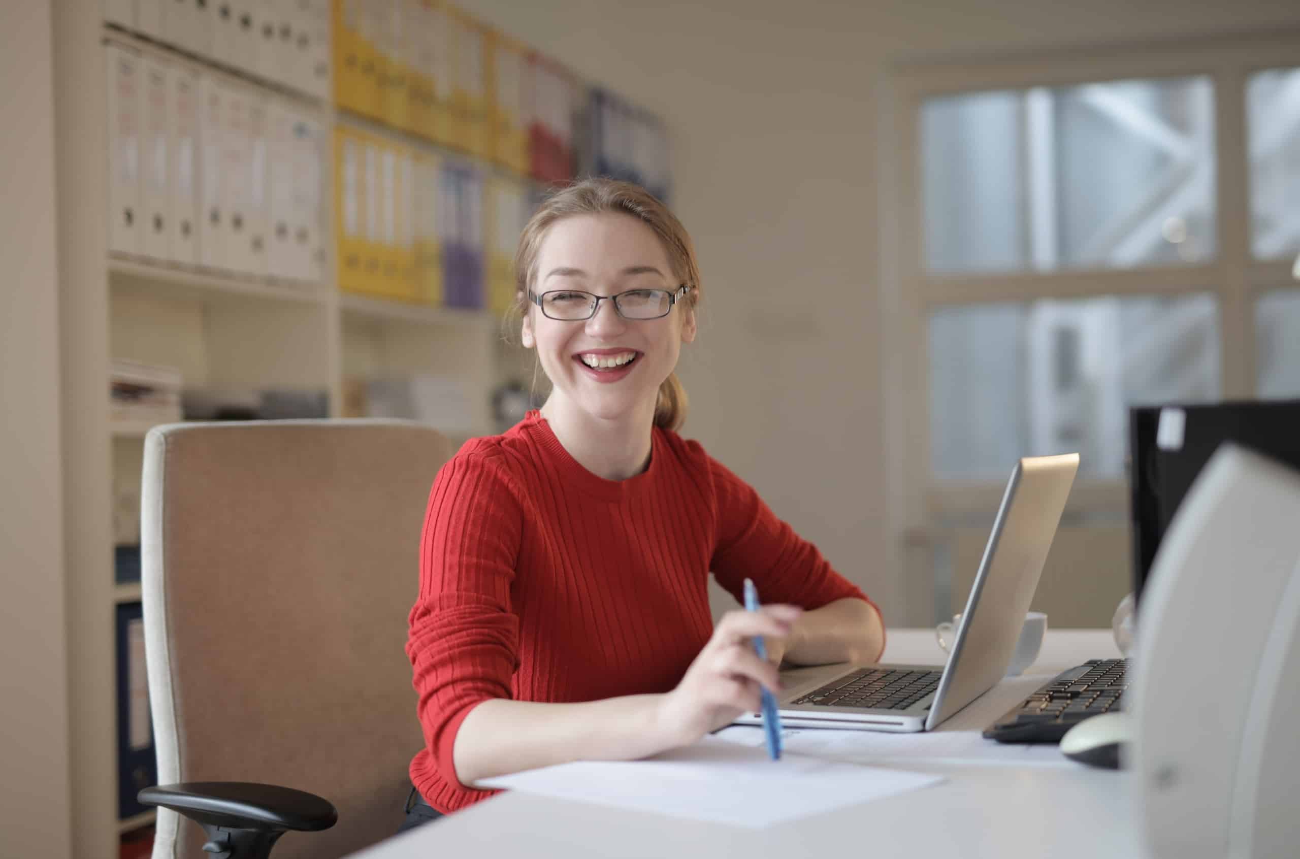 Happy girl in front of laptop